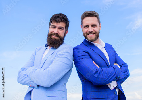 Business people concept. Bearded business people posing confidently. Business men stand blue sky background. Perfect in every detail. Well groomed appearance improves business reputation entrepreneur