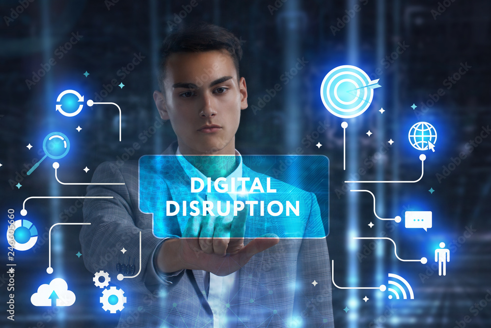 The concept of business, technology, the Internet and the network. A young entrepreneur working on a virtual screen of the future and sees the inscription: digital disruption The concept of business, technology, the Internet and the network. A young entrepreneur working on a virtual screen of the future and sees the inscription: digital disruption