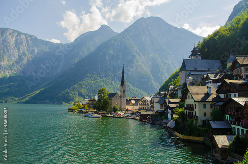 Classic postcard view of famous Hallstatt lakeside town in the Alps on a beautiful sunny day in summer, Salzkammergut region, Austria