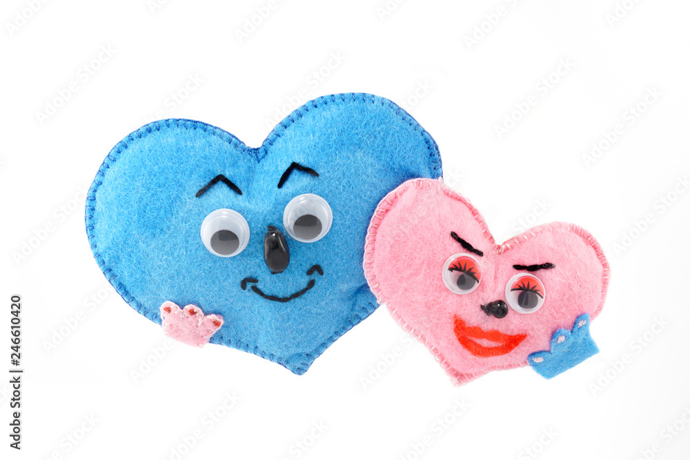 Fototapeta premium small soft homemade toy in the form of a heart for Valentine's Day on a white isolated background