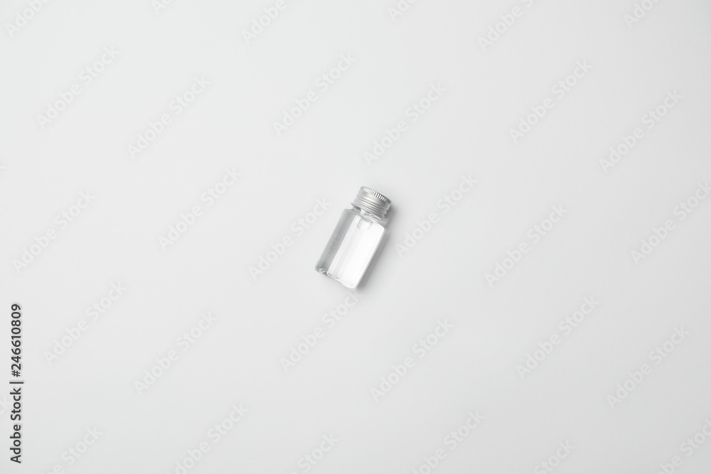 Top view of transparent cometic bottle on white background with copy space Top view of transparent cometic bottle on white background with copy space