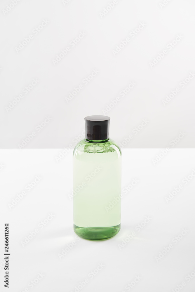 Cosmetic bottle with lotion on white background with copy space Cosmetic bottle with lotion on white background with copy space