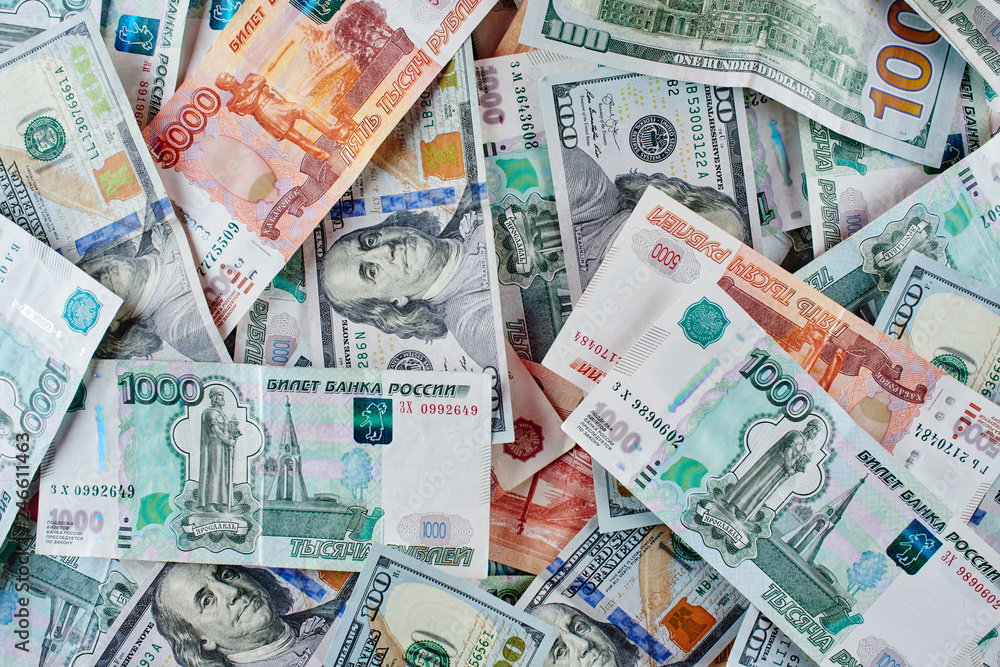 Rubles and dollars. Background of paper Russian and American money Rubles and dollars. Background of paper Russian and American money
