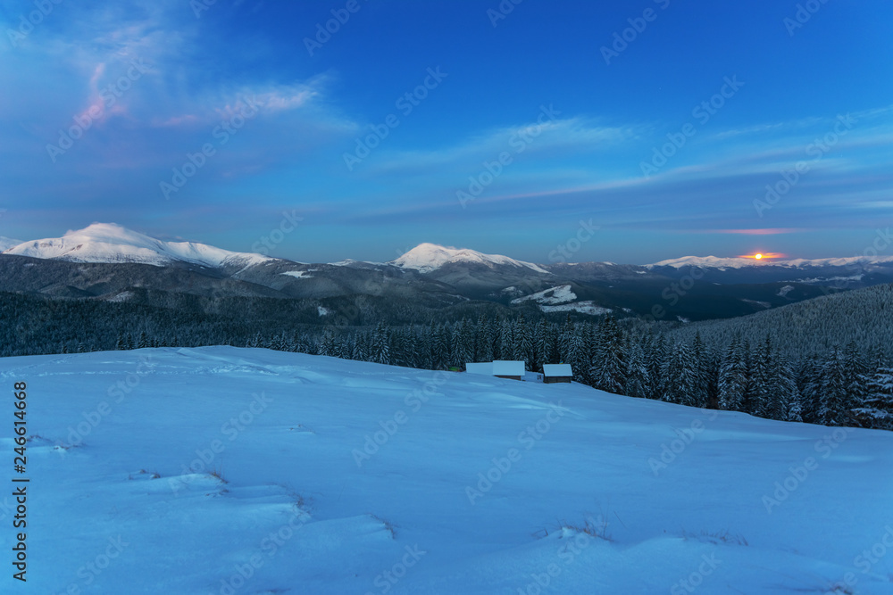 Charming lunar and starry nights with the Milky way in the Ukrainian Carpathians with mountain houses.