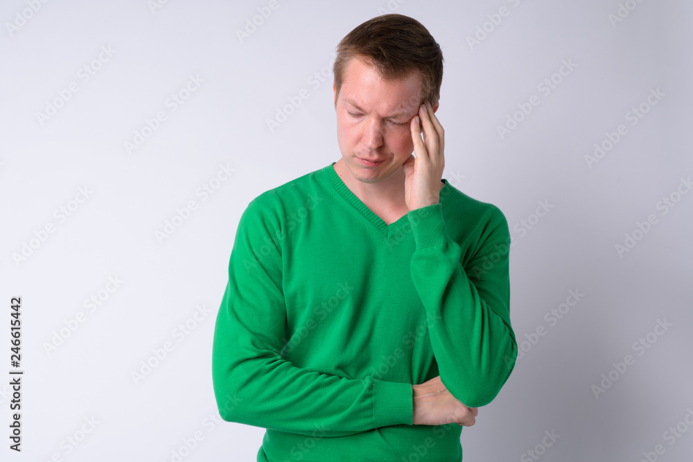 Portrait of stressed young man having headache Portrait of stressed young man having headache