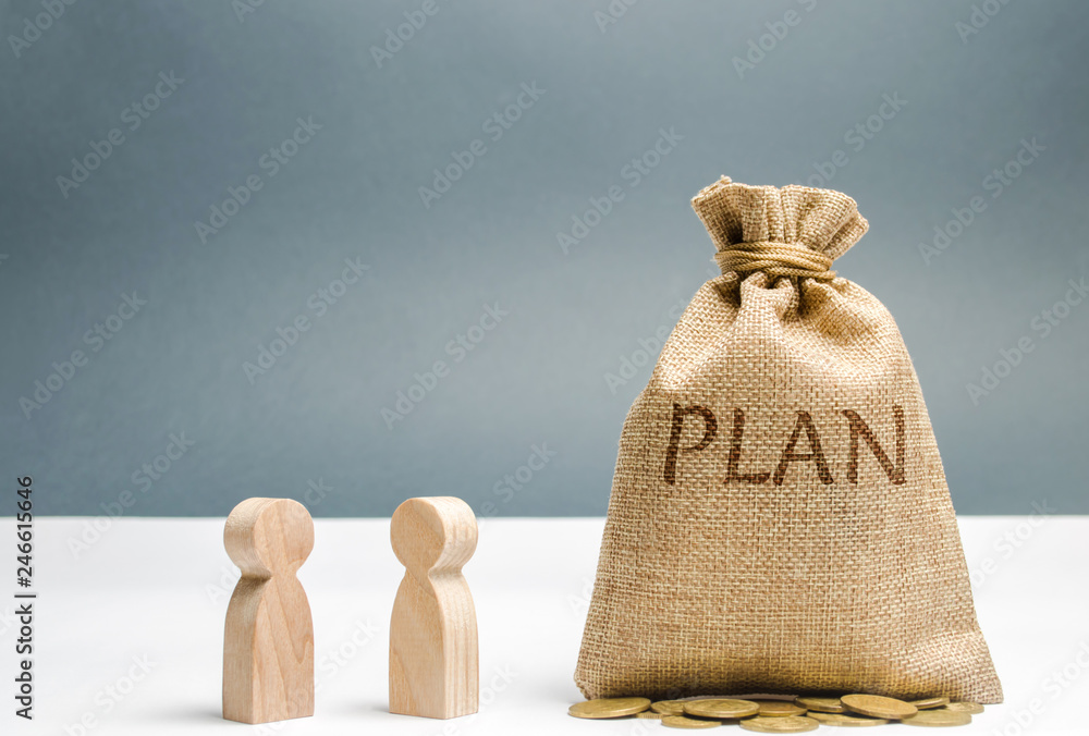 Two businessmen are discussing the plan of expenses and finances. Financial investments and goal putting a plan into action. Saving and accumulation money to make your dreams. Business planning Two businessmen are discussing the plan of expenses and finances. Financial investments and goal putting a plan into action. Saving and accumulation money to make your dreams. Business planning