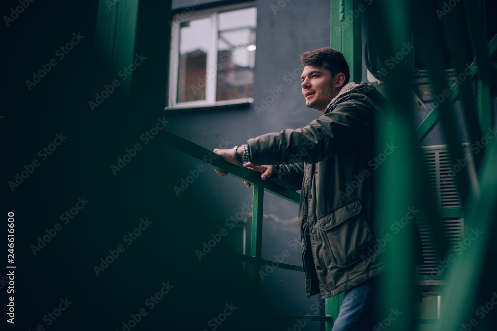 Portrait of a young man in an industrial landscape. Portrait of a young man in an industrial landscape.
