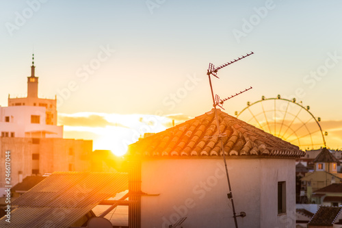 Rooftops and a skywheel in Malaga  Spain