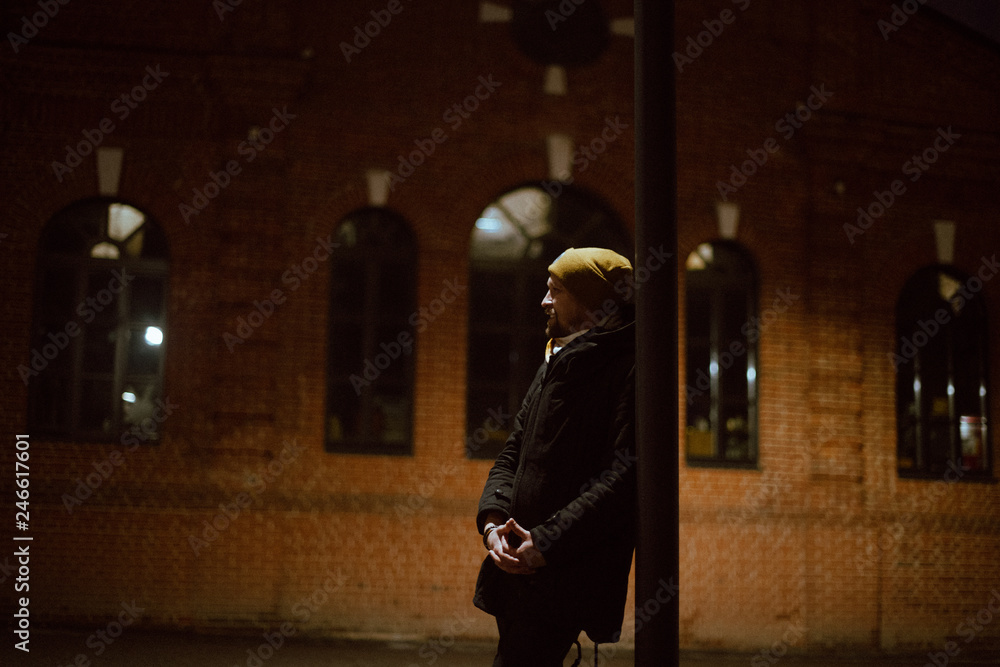 Portrait of a young man against the background of the evening cityscape. Portrait of a young man against the background of the evening cityscape.