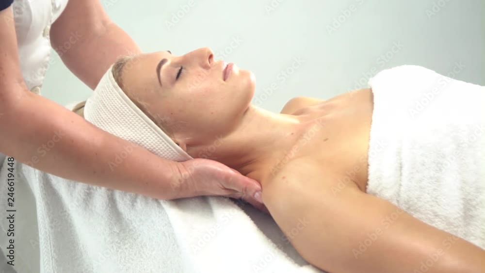 Young attractive woman getting spa treatment over white background Young attractive woman getting spa treatment over white background