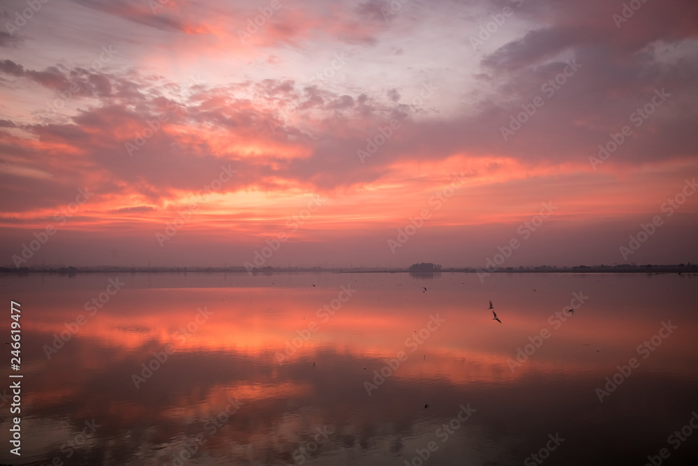 A beautiful winter morning golden light at river with its beautiful reflection A beautiful winter morning golden light at river with its beautiful reflection