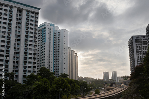 Public housing HDB residentIal apartments with LRT track during sunset in Singapore