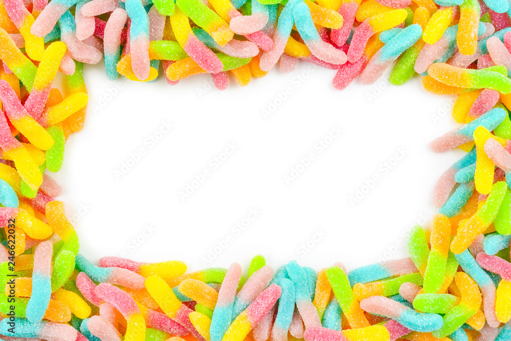 Frame of colorful gummy candies isolated on white. Top view. Space for text or design.