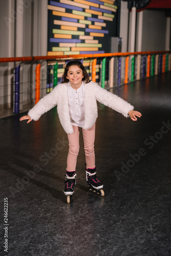 Little roller skater skating with sincere smile © LIGHTFIELD STUDIOS