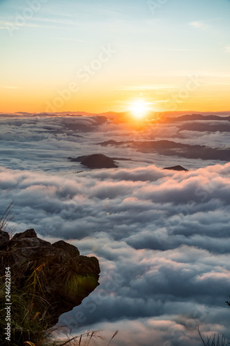 sunrise and sea of fog view on phu chi fa mountain area and national forest park in chiang rai, Thailand. photo