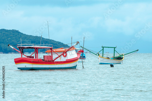 Fishing boats anchored on the sea. Boats at Bombinhas  Praia de Zimbros beach.