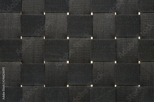 Close up criss cross webbing of an outside chair. Full frame background texture.