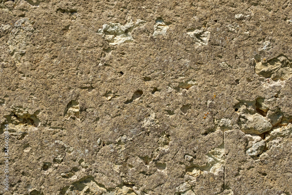 Roughly rendered rubble wall construction exterior - full frame texture background Roughly rendered rubble wall construction exterior - full frame texture background
