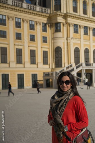 Beautiful woman in front of a yellow castle