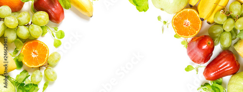 flat lay top view tropical fruits frame background: grape, rose apple, orange, spinach, mango, pear, guava and banana. Healthy drink ingredients. Vegetarian, vegan food concept. Detox. Text space