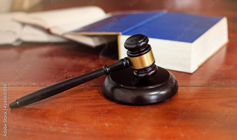 The judge gavel,Hammer of justice,blurry light around,Law concept The judge gavel,Hammer of justice,blurry light around,Law concept
