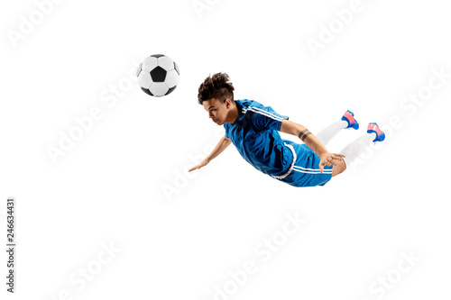 Young boy with soccer ball doing flying kick, isolated on white. football soccer players in motion on studio background. Fit jumping boy in action, jump, movement at game. photo