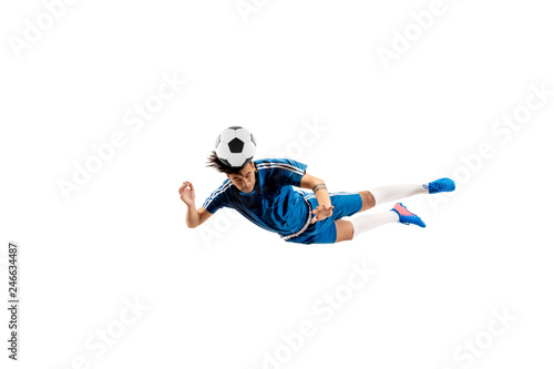 Fototapeta Naklejka Na Ścianę i Meble -  Young boy with soccer ball doing flying kick, isolated on white. football soccer players in motion on studio background. Fit jumping boy in action, jump, movement at game.