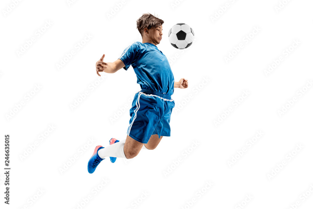 Fototapeta premium Young boy with soccer ball doing flying kick, isolated on white. football soccer players in motion on studio background. Fit jumping boy in action, jump, movement at game.