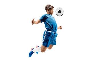 Young boy with soccer ball doing flying kick, isolated on white. football soccer players in motion on studio background. Fit jumping boy in action, jump, movement at game.