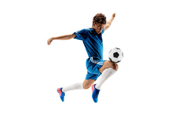 Young boy with soccer ball doing flying kick, isolated on white. football soccer players in motion on studio background. Fit jumping boy in action, jump, movement at game.