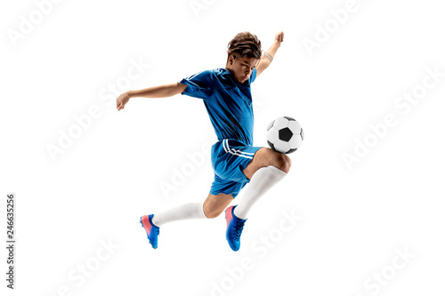Young boy with soccer ball doing flying kick, isolated on white. football soccer players in motion on studio background. Fit jumping boy in action, jump, movement at game. © master1305