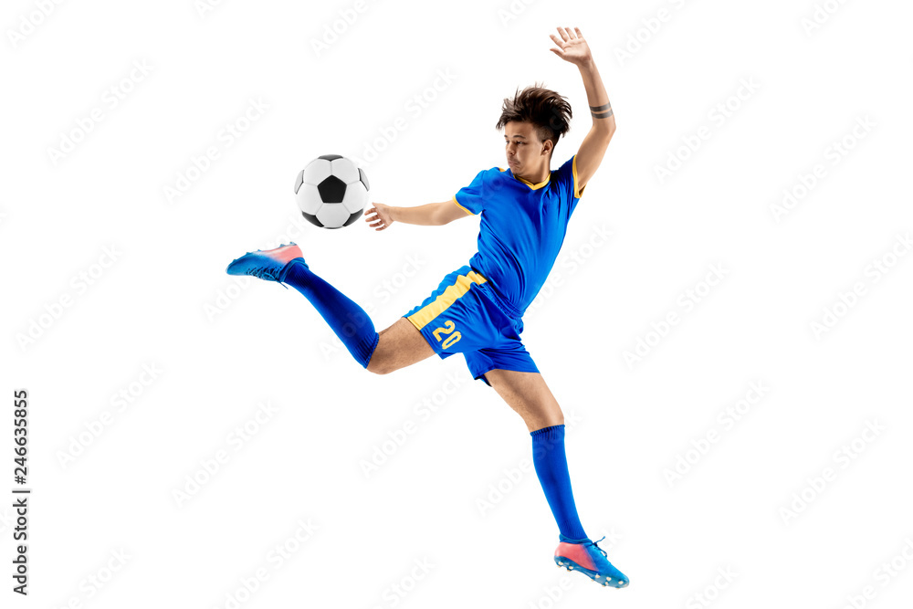 Fototapeta premium Young boy with soccer ball doing flying kick, isolated on white. football soccer players in motion on studio background. Fit jumping boy in action, jump, movement at game.