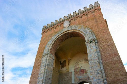 Siena city gate, Antiporto di Camollia, with blue sky on the background, Tuscany, Italy photo