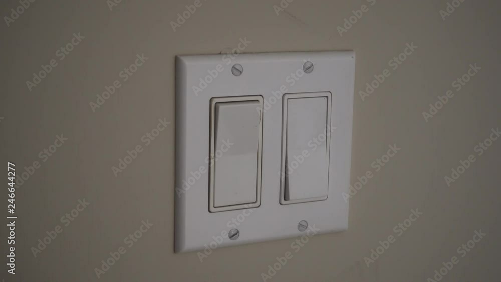 4K Mans Hand Turning On Second Light Switch In Double Switch 4K Mans Hand Turning On Second Light Switch In Double Switch