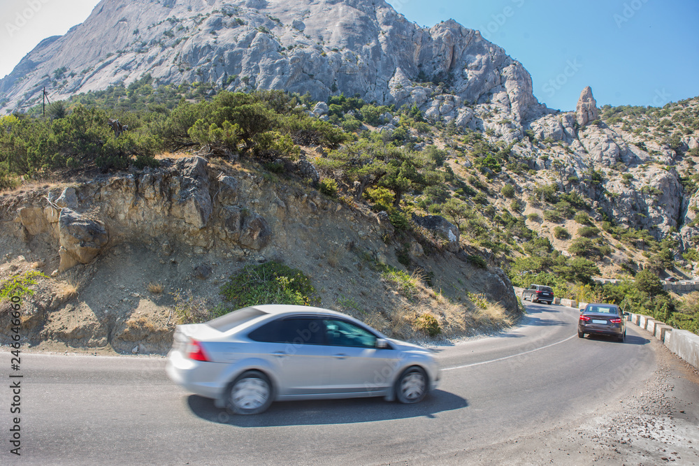 Cars Moves along a winding road in the mountains