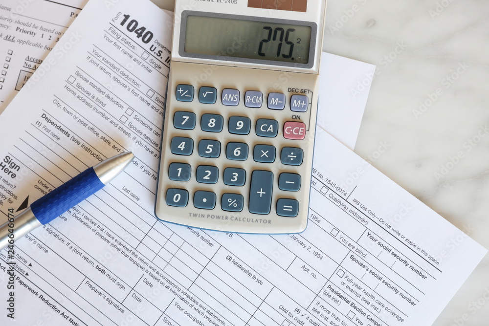 Tax Forms calculator pen paper finance business Tax Forms calculator pen paper finance business