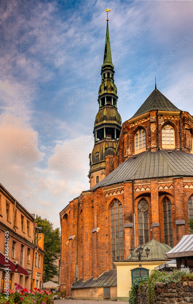 Medieval church of Saint Peter in old district of Riga - the capital and largest city of Latvia, a major commercial, cultural, historical and tourist center of the Baltic region Medieval church of Saint Peter in old district of Riga - the capital and largest city of Latvia, a major commercial, cultural, historical and tourist center of the Baltic region