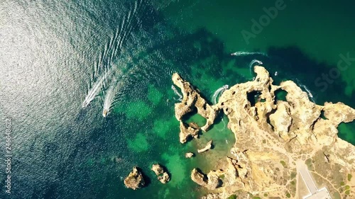 Aerial of Scenic Ponta da Piedade of Lagos, Portugal. Rugged seaside cliffs and aqua ocean waters in the Algarve region of Portugal