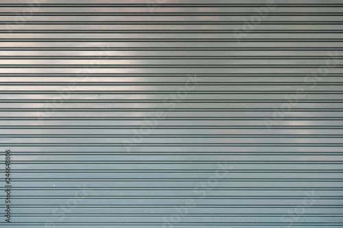 close-up shot of aluminum steel metal roller shutter door texture for backdrop design.