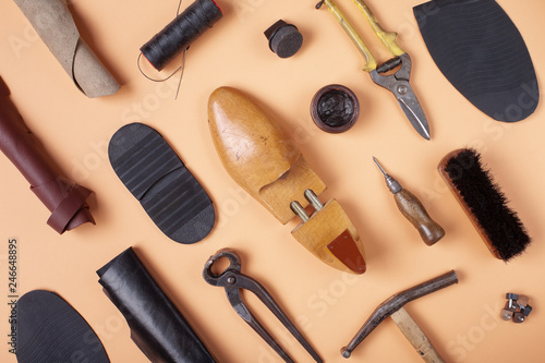 Fotografía Tools for shoe repair on blue background