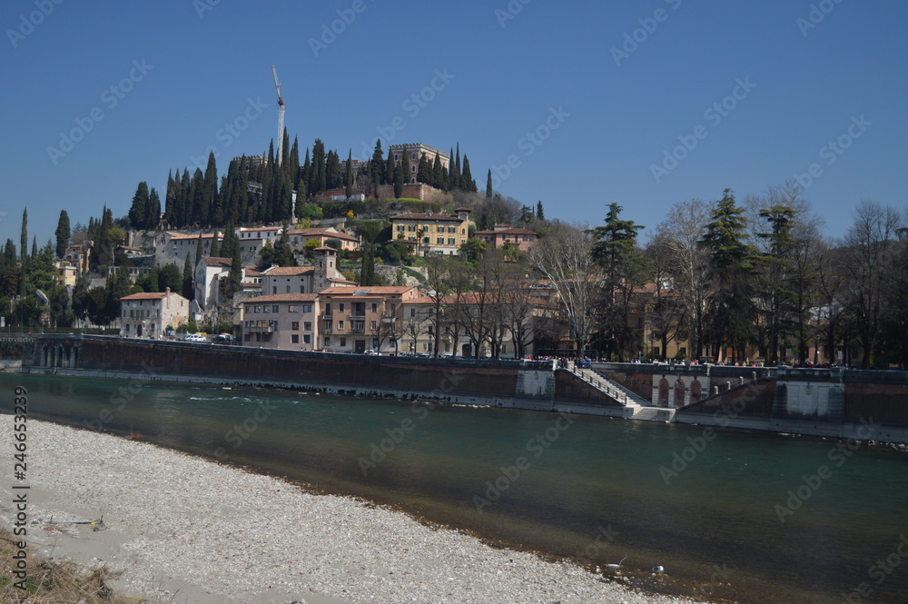 Obraz premium Rio Adige At Its Pass In Verona. Travel, holidays, architecture. March 30, 2015. Verona, Veneto region, Italy.