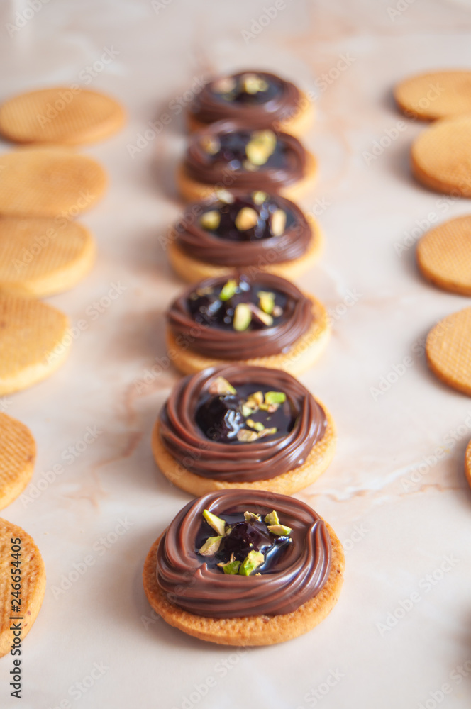 cookies with chocolate cream, cherry and pistachio cookies with chocolate cream, cherry and pistachio