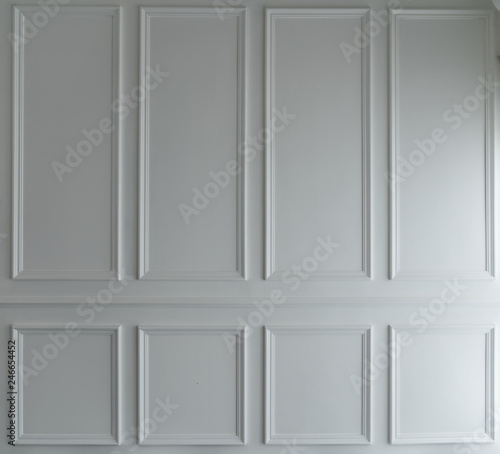 Classice wooden stripe frame install on white painted wall / background concept/ set scene / natural light