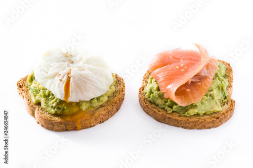 Toasted breads with avocado, poached eggs and salmon isolated on white background. 