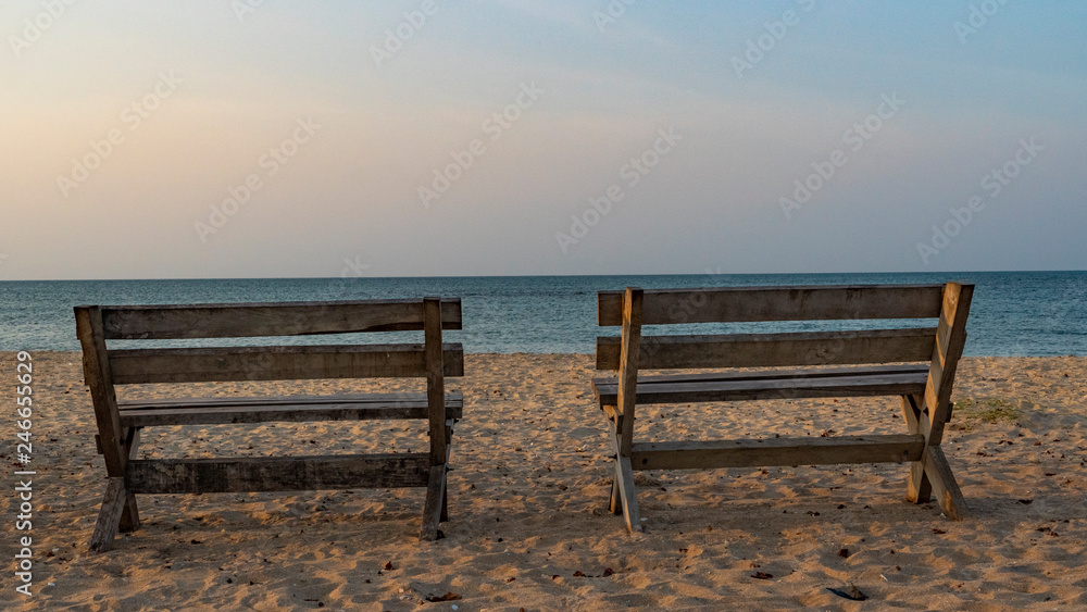 Couple Of Benches By The Ocean On The Sunset Couple Of Benches By The Ocean On The Sunset