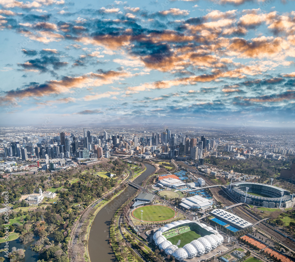 Aerial city view from helicopter at sunset, Melbourne