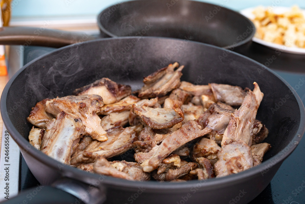 Rack of lamb barbecue on black grilled pan. Process the roasting meat. Grilled food. Rack of lamb barbecue on black grilled pan. Process the roasting meat. Grilled food.