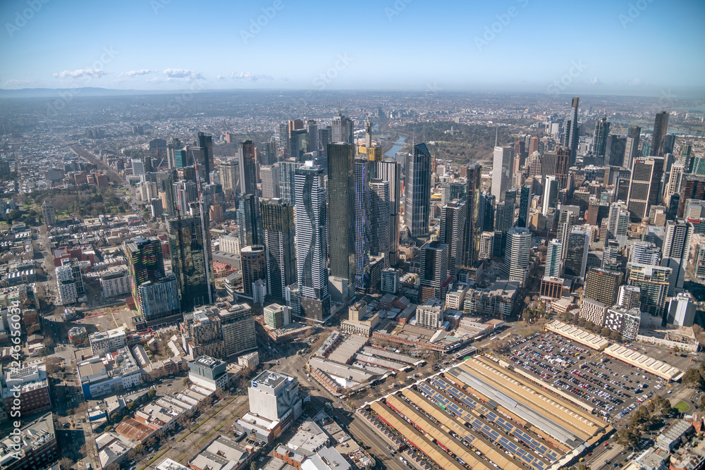 MELBOURNE - SEPTEMBER 8, 2018: Aerial view of city skyline and car parking from helicopter. Melbourne attracts 15 million people annually
