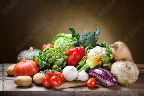 Fresh vegetables on rustic background, space for text