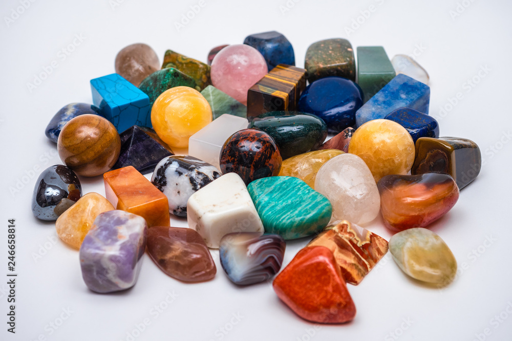Collection of various crystals and semi precious gemstones and mineral stone on white background Collection of various crystals and semi precious gemstones and mineral stone on white background